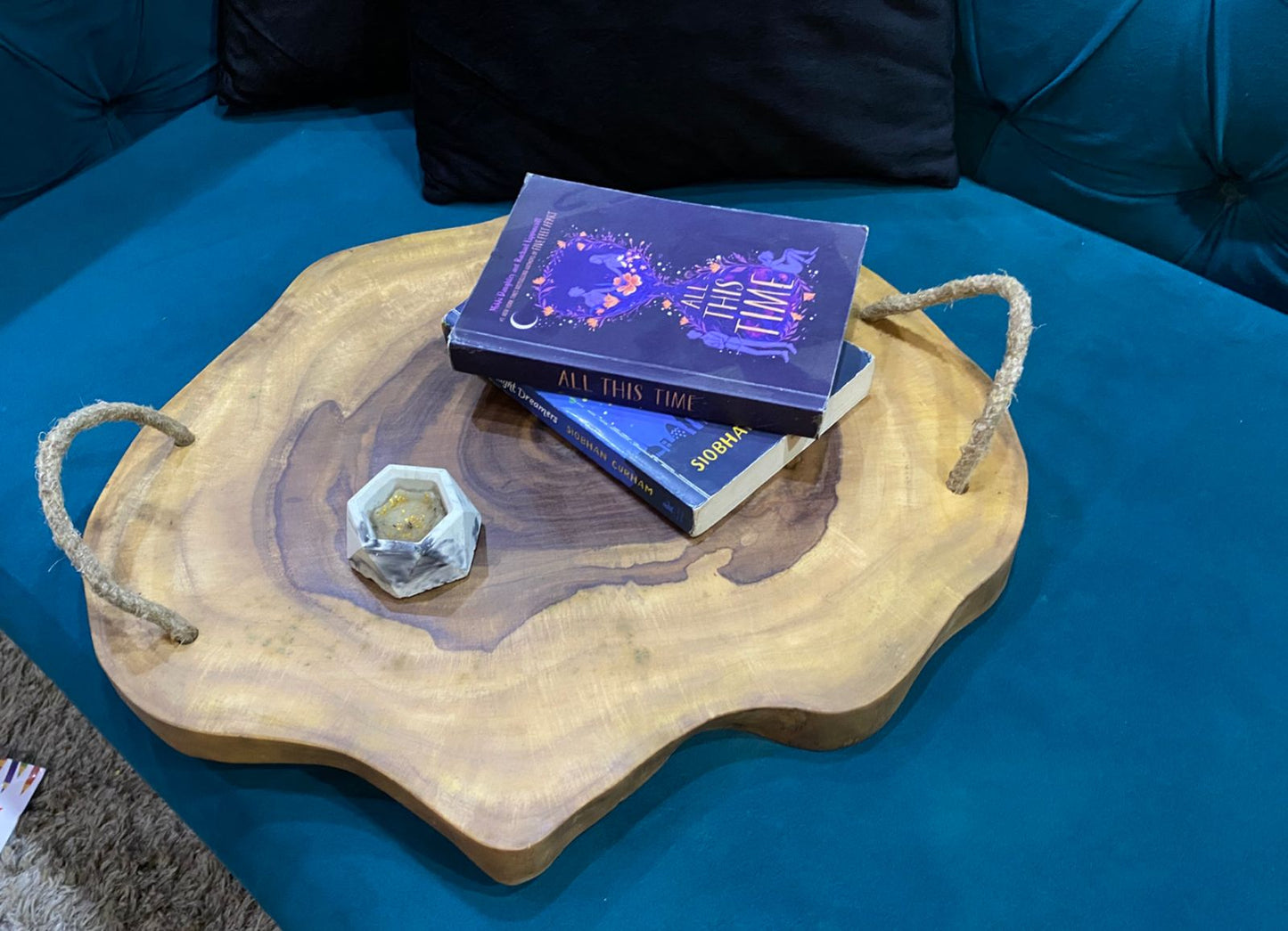 Side angle of handcrafted Sheesham live edge serving tray with rope handles