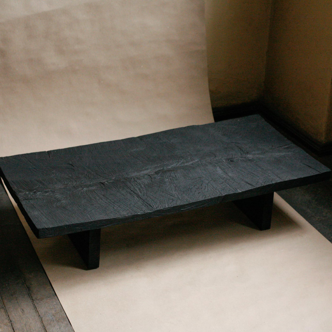 Handcrafted burnt solid Sheesham wood table with natural charred finish by Adaptivo Furniture.