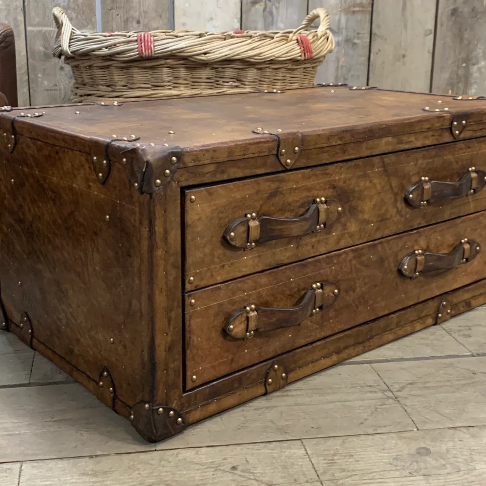 Vintage leather coffee table trunk placed in modern living room interior