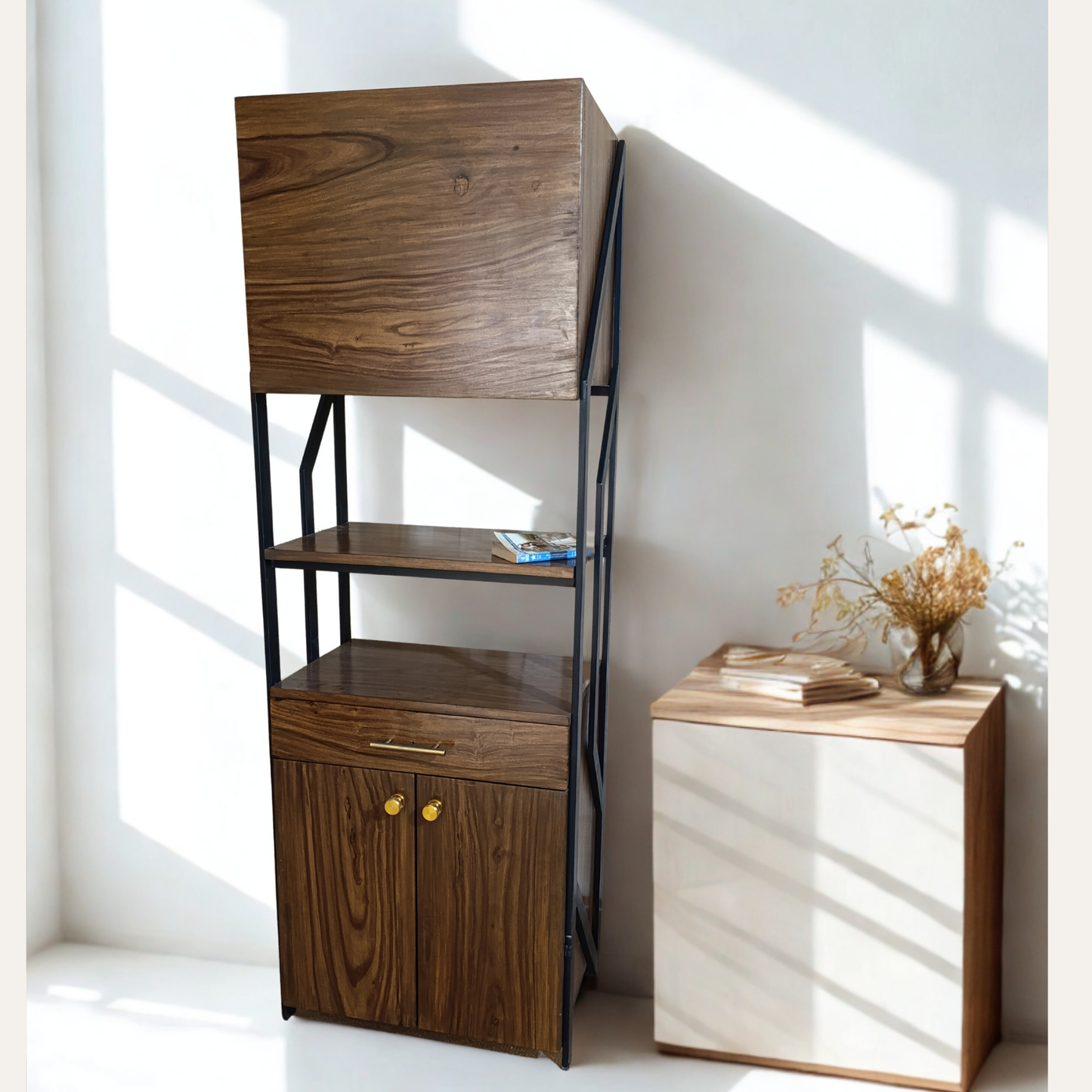 Close-up of natural Sheesham wood grains and brass handle details on bookshelf cabinet.