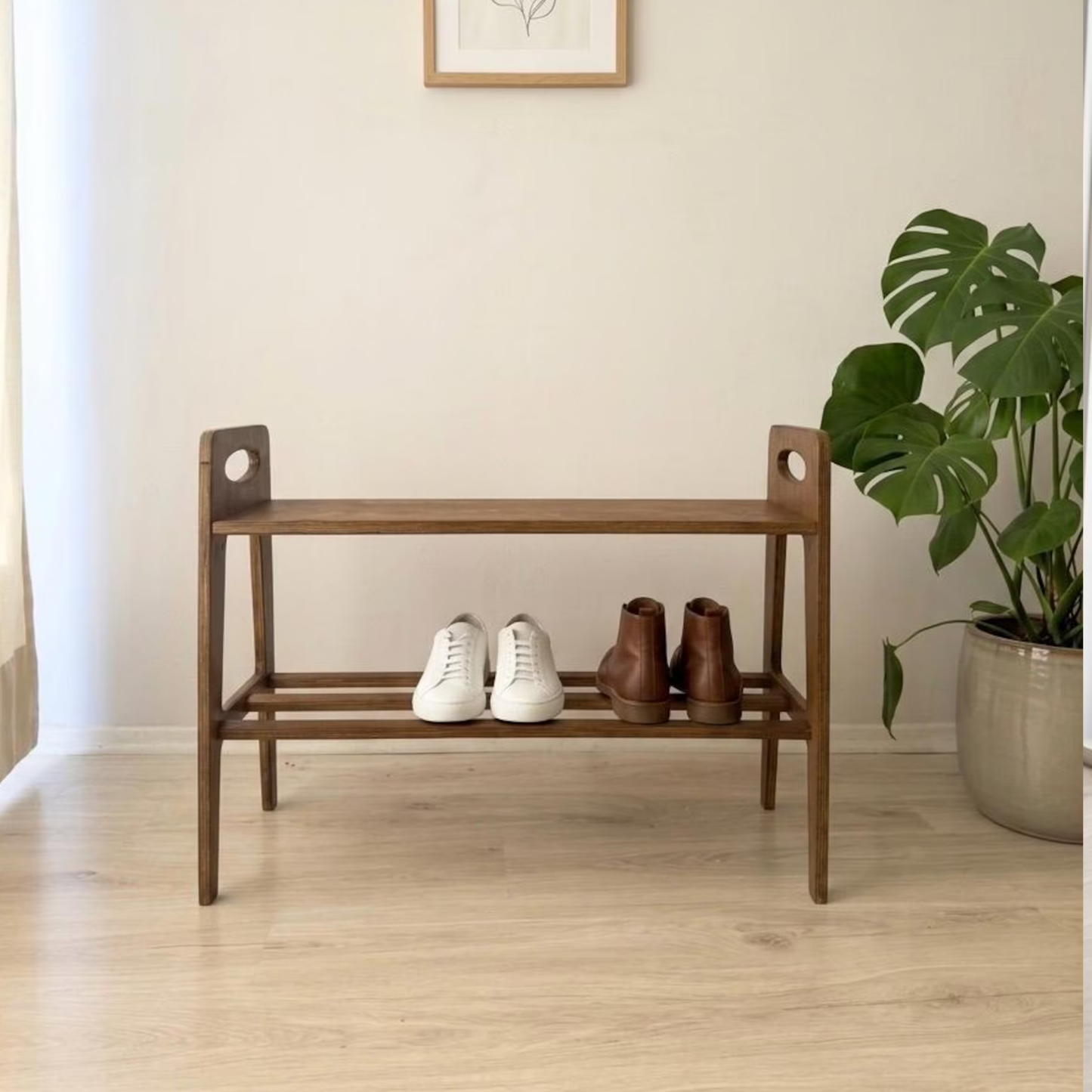 Solid Sheesham wood shoe rack styled in an entryway with shoes, indoor plants, and decorative accessories, bringing warmth and practical storage to contemporary interiors.