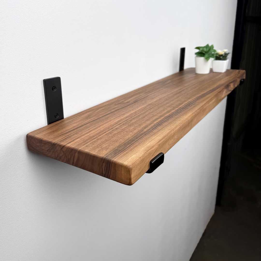Handmade Sheesham wood floating shelves with industrial steel brackets for modern home decor.