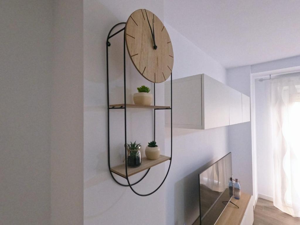 Adaptivo rustic charm wall clock with storage compartment