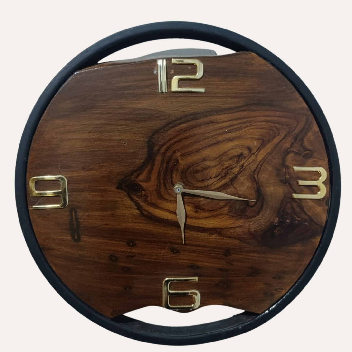 Black Roman Numeral Dark Sheesham Wall Clock displayed on living room wall – Rustic modern décor by Adaptivo Furniture