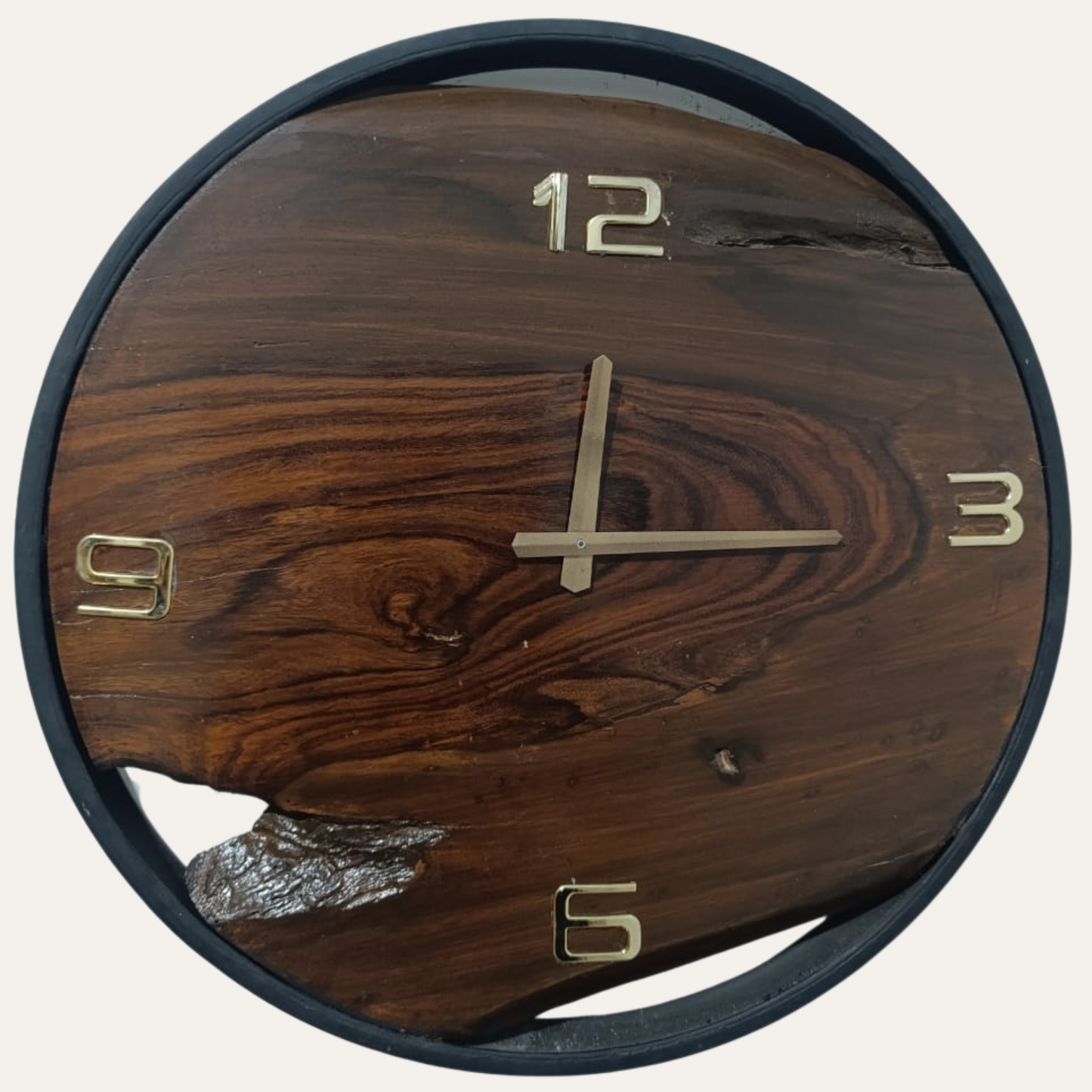 Close-up of Dark Sheesham Wood Wall Clock showing black Roman numerals and natural wood grain finish