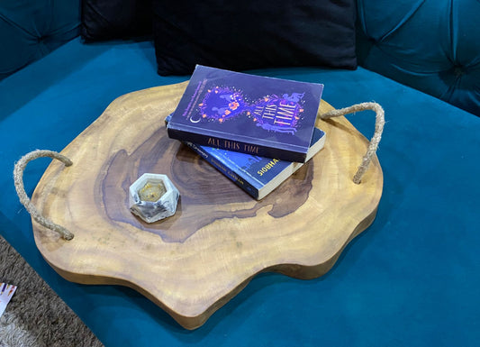 Side angle of handcrafted Sheesham live edge serving tray with rope handles